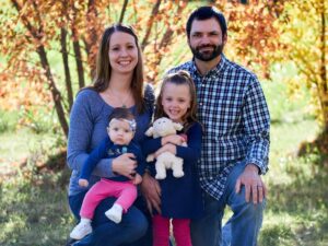 LASIK eye surgery patient Kimberlee Gonsor with husband and two young kids on a fall day.