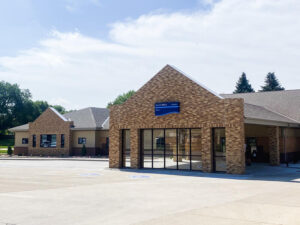 Brick exterior of Sanford Sheldon Clinic on a sunny day.