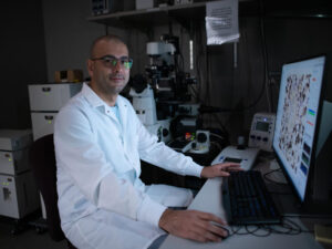 Abdelhalim Loukil studies a computer image of brain cells in his lab.