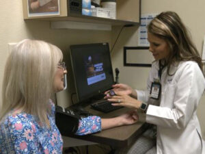 Mature patient gets her blood pressure checked with her family medicine provider at Sanford Health.