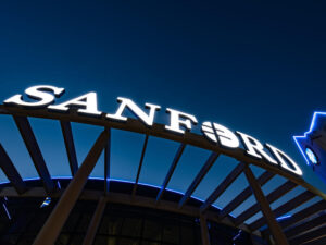 Sanford sign lit up at night.