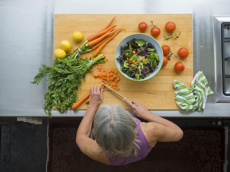 overhead view, woman making salad.