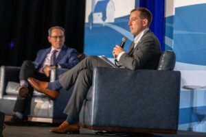 Dr. Jesse Ehrenfeld speaks with Dr. Luis Garcia on the rural health summit stage.