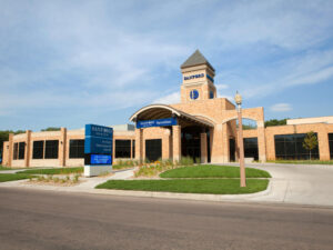 Brick hospital with center tower.