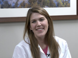 Smiling doctor in a white coat.