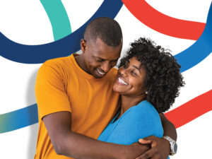 Happy couple hugs with blue and red graphic loops behind them.