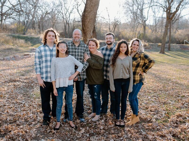 Family portrait in autumn outdoor scene