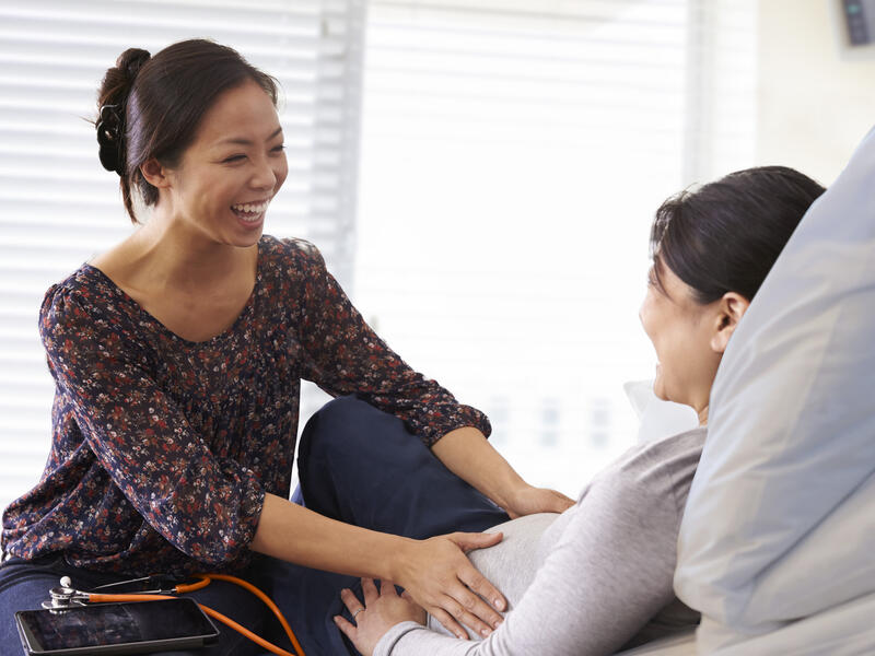 Pregnant Woman Being Examined by Clinician