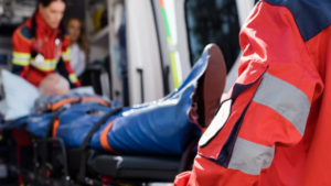 Paramedics load patient into ambulance