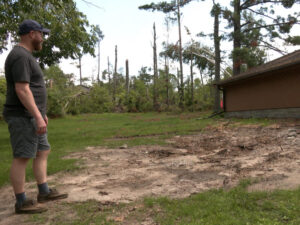 Man looks at damage after Bemidji storm