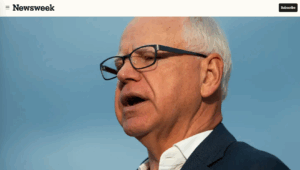 Minnesota Gov. Tim Walz speaking under a blue sky.