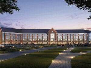 Ground-view rendering of new hospital with South Dakota's Black Hills reflected in the windows.
