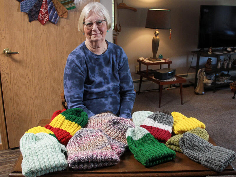 Handcrafted hats provide warmth for tight-knit community
