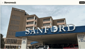 Screenshot from Newsweek with photo looking up at Sanford Medical Center.