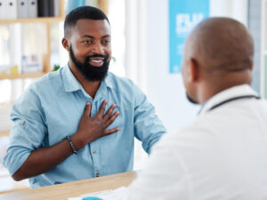 Young man in a consult with his primary care provider.