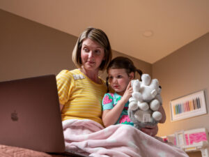 mom and daughter on computer for virtual care visit