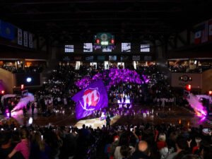 Phoenix Mercury "M" flag flies across the floor of a packed Sanford Pentagon gym.