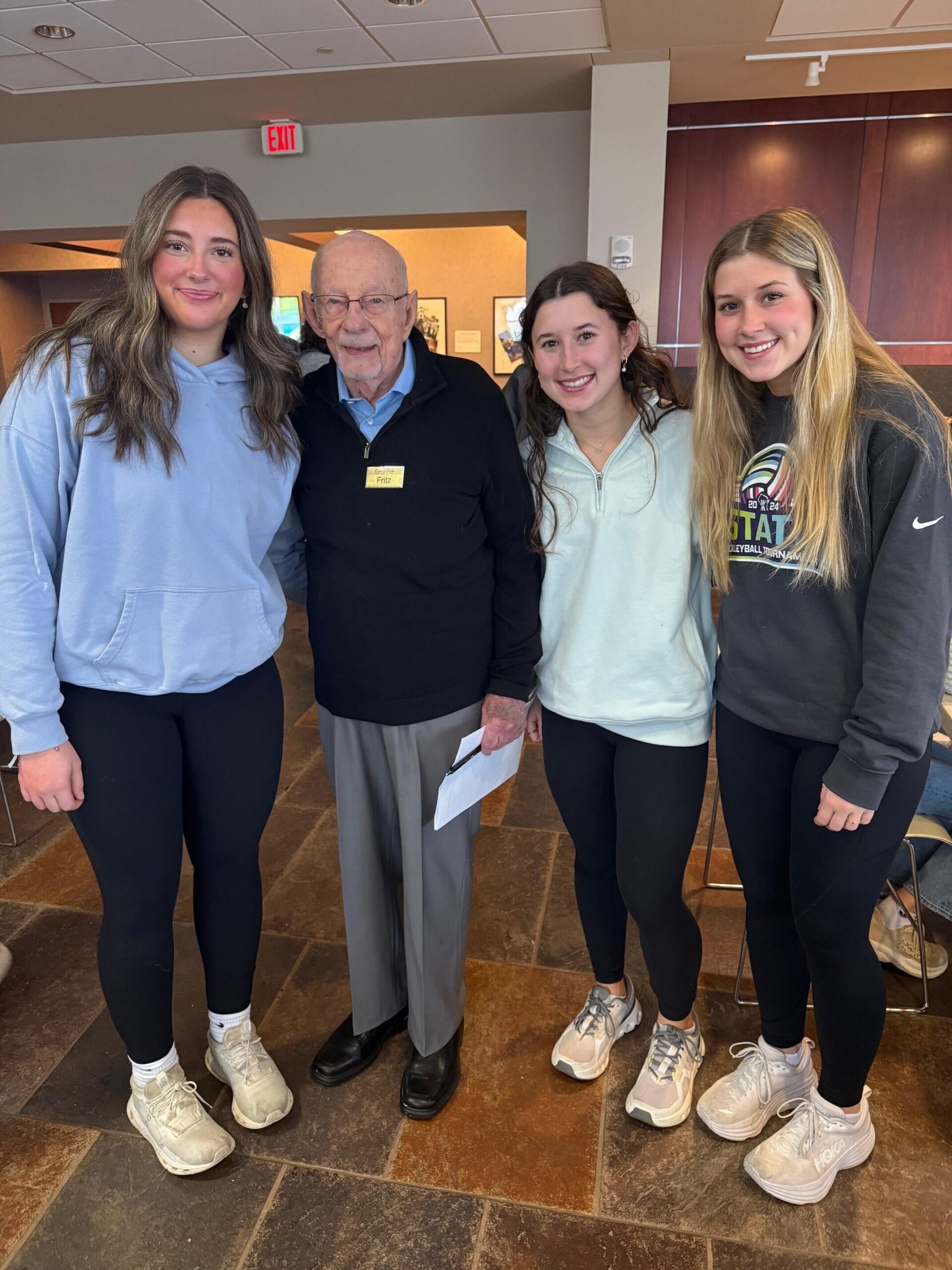 Fritz Wenzel with three high school students.