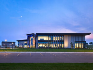 Modern virtual health care building at sunset.