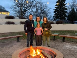 family members around a campfire