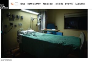 Screenshot from Twin Cities Business with photo of empty hospital bed