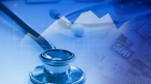 Stethoscope on a stack of graphs and money.