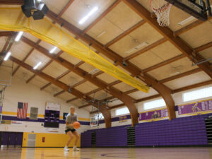 One basketball player gets ready for a free throw in a university gym.