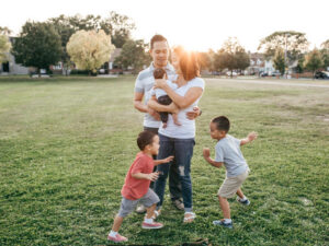 Family with three kids having fun.