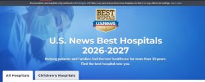 Samiling healthcare worker in surgical mask behind headline "U.S. News Best Hospitals 2026-2027"