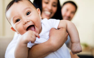 Your baby’s first smile brings out their social side