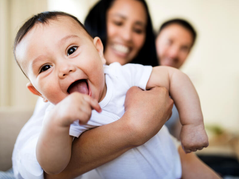 Your baby’s first smile brings out their social side