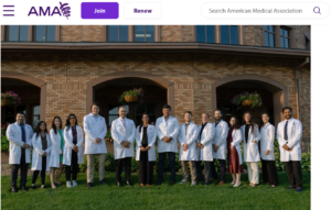 Group of medical students in front of brick archways.