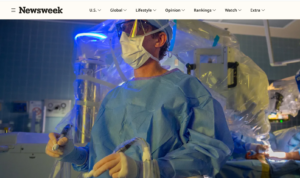 A doctor with a robot in the operating room.